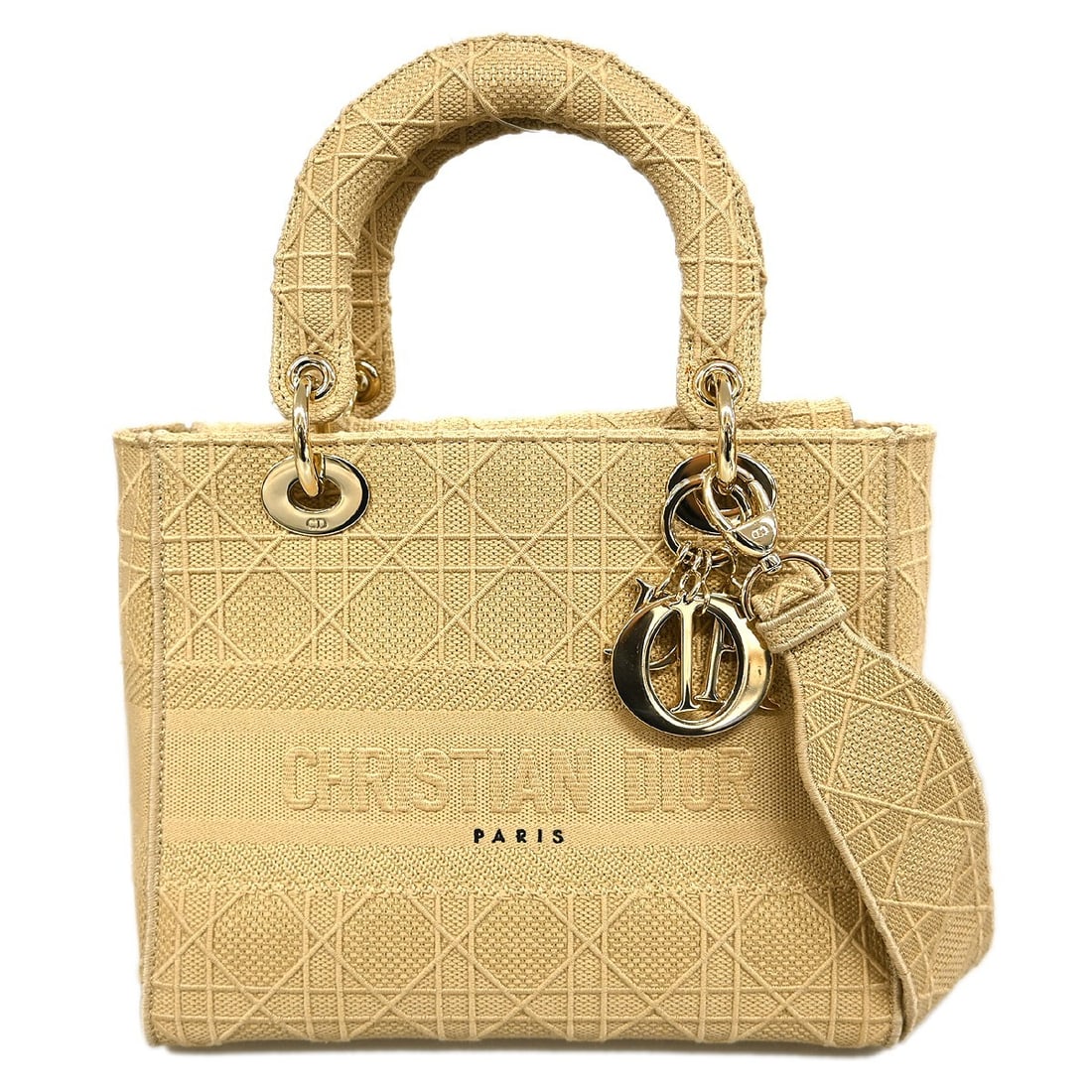 Christian Dior Lady D-Lite canvas handbag beige Italy: Christian Dior Lady D-Lite canvas handbag beige Italy The Christian Dior Lady D-Lite is a beige canvas handbag with the house's Cannage embroidered design. Made in Italy, this piece is presented in ve