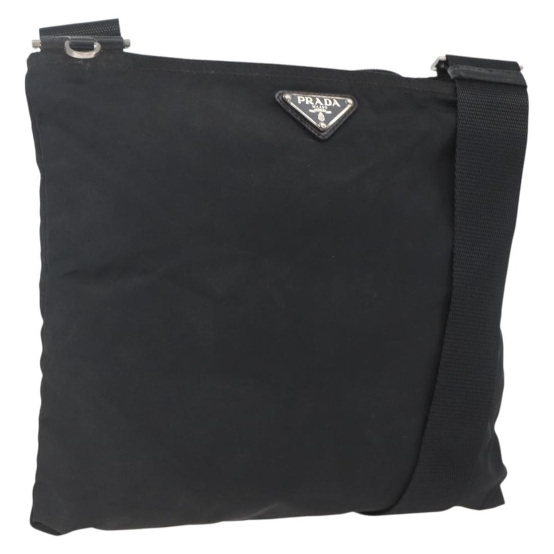 Prada nylon black silver women shoulder bag Italy: Prada nylon black silver women shoulder bag Italy This PRADA shoulder bag is crafted from black nylon with silver-tone accents, offering a sleek and versatile look. Designed for women, it features an 