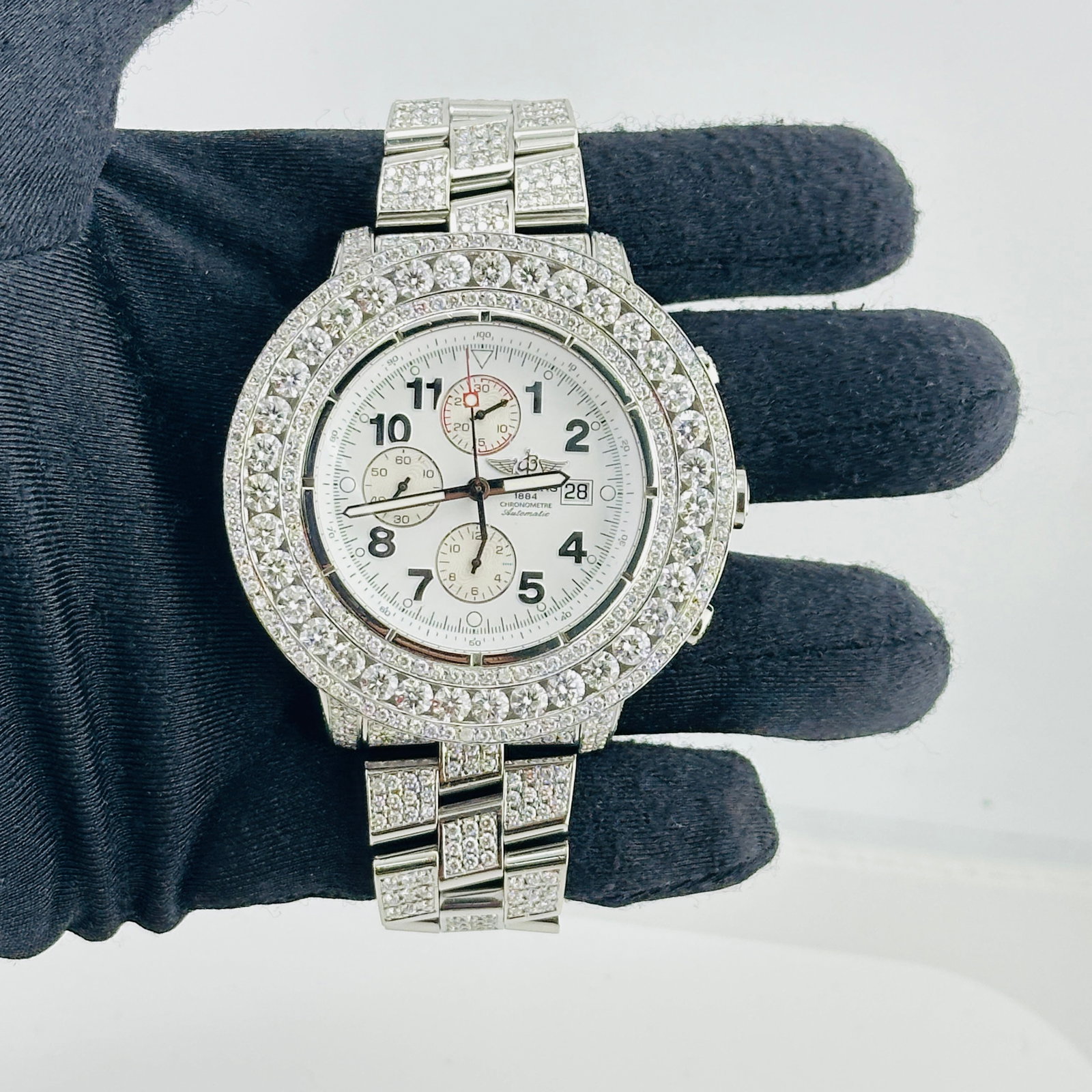 Breitling A13370 Super Avenger mens watch white Arabic dial diamond bezel: Breitling A13370 Super Avenger mens watch white Arabic dial diamond bezel Breitling Super Avenger wristwatch featuring a white Arabic dial with a diamond bezel and diamond bracelet. This men's watch i