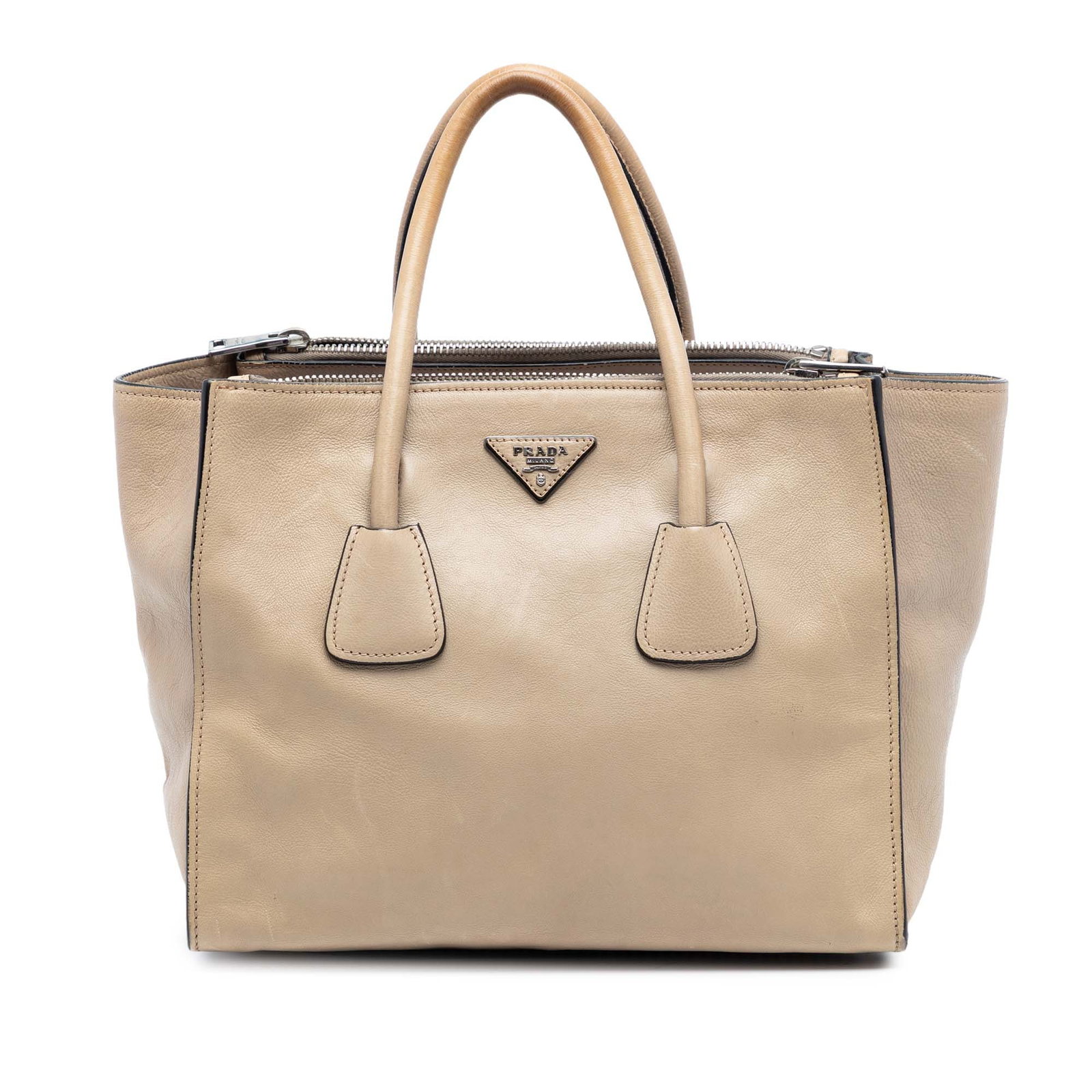 Prada Twin Pocket Satchel in Beige Calf Leather with Double Handles: Prada Twin Pocket Satchel in Beige Calf Leather with Double Handles This Prada Glace Calf Twin Pocket Double Handle Satchel is crafted from beige calf leather and features rolled leather handles, an o