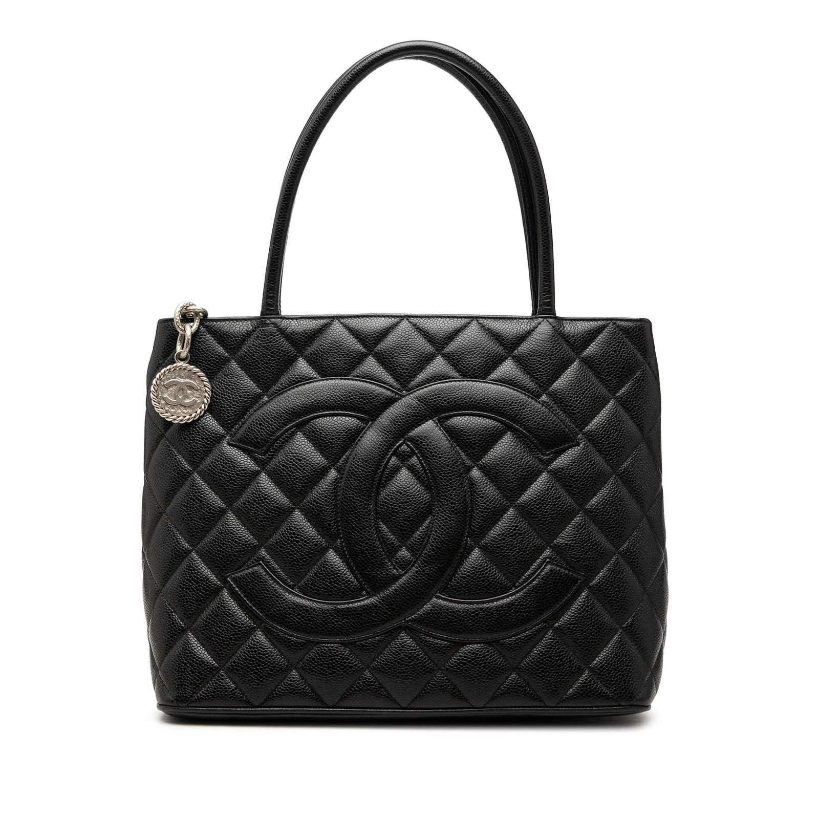 Chanel Medallion Tote Black Caviar Leather Handbag: Chanel Medallion Tote Black Caviar Leather Handbag Chanel Medallion tote crafted in quilted caviar leather with rolled leather handles and a top zip closure. The design includes an exterior back slip 