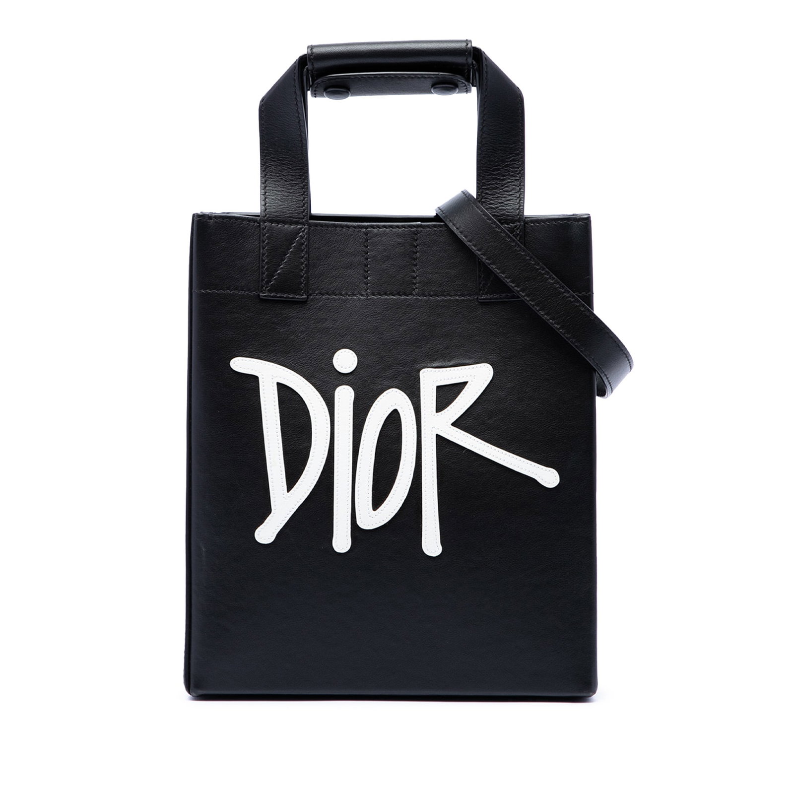 Dior Stussy logo applique leather satchel tote black: Dior Stussy logo applique leather satchel tote black Dior Stussy Small Logo Applique Tote in black leather with flat leather handles, a detachable and adjustable flat leather strap, an open top with m