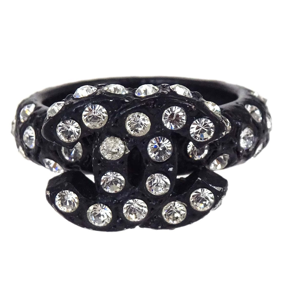 Chanel CC Black Acrylic Rhinestone Ring Size 52 France: Chanel CC Black Acrylic Rhinestone Ring Size 52 France Vintage Chanel ring in black acrylic with rhinestone CC detailing. Made in France, this ring shows scuffs and dirt consistent with prior use. No 