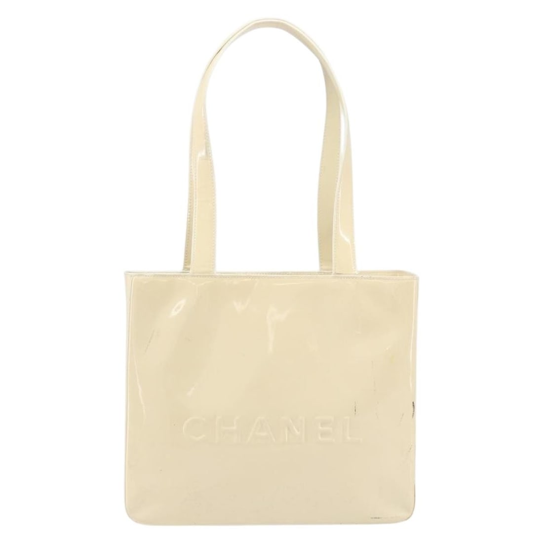 Chanel Vintage Embossed Logo Shoulder Bag Beige Patent Leather: Chanel Vintage Embossed Logo Shoulder Bag Beige Patent Leather Vintage Chanel shoulder bag in beige patent leather with an embossed logo design. This pre-owned piece shows honest vintage wear througho