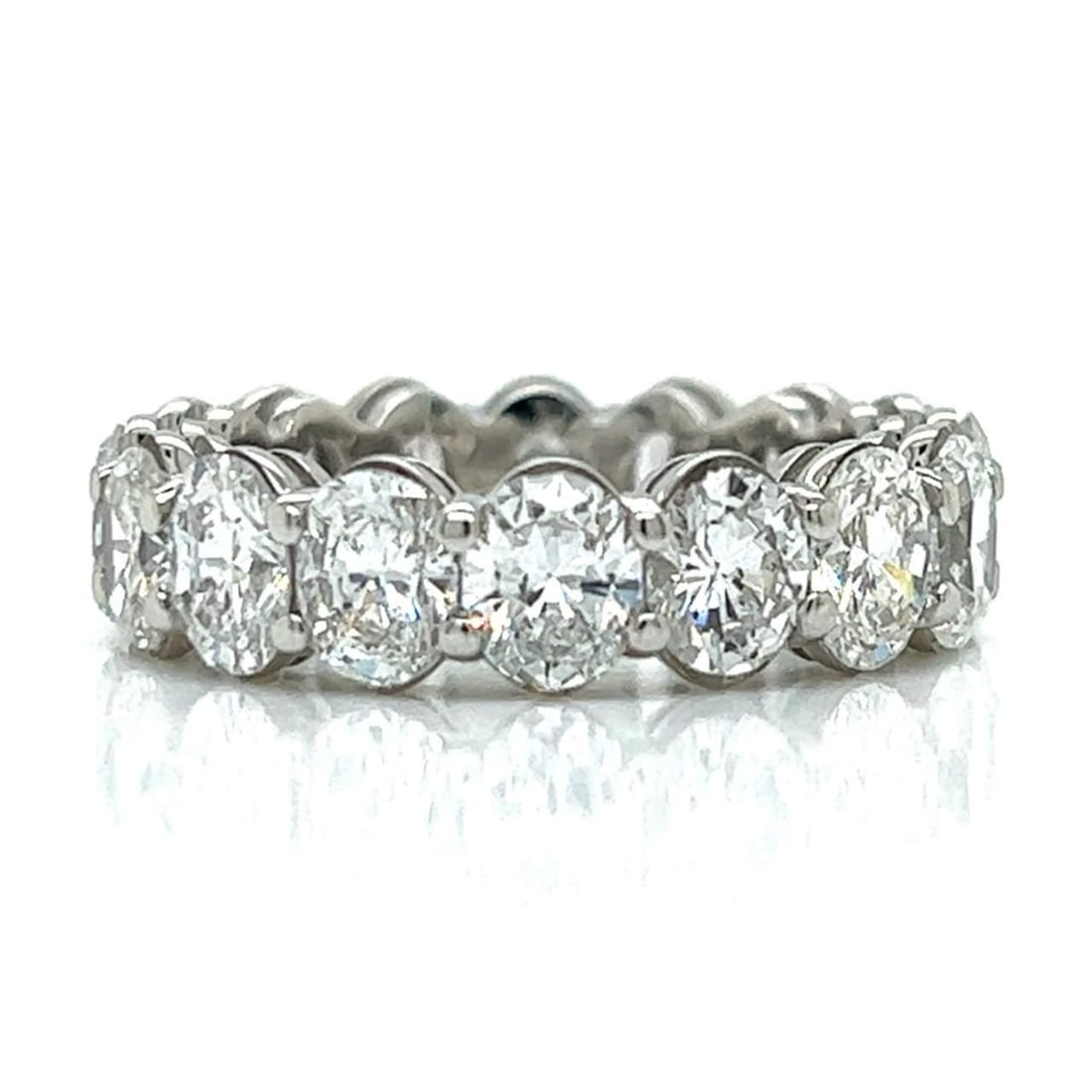 Platinum 6.00 Ct Diamond Eternity Band with 16 Oval Diamonds: Platinum 6.00 Ct Diamond Eternity Band with 16 Oval Diamonds This exquisite Platinum Diamond Eternity Band features a stunning array of 16 oval diamonds, totaling approximately 6.00 carats. The diamon