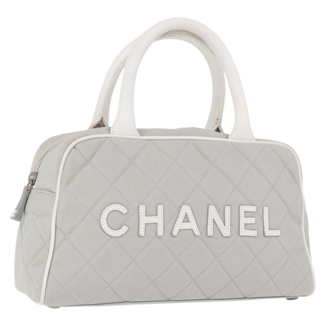 CHANEL Gray Silver Canvas Hand Bag CC Italy: CHANEL Gray Silver Canvas Hand Bag CC Italy Chanel sports hand bag in gray and silver canvas with a compact silhouette and short handle. Made in Italy, this women's bag is offered without the original