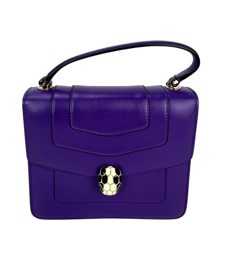 Bvlgari Serpenti Purple Calfskin Top Handle Crossbody Bag: Bvlgari Serpenti Purple Calfskin Top Handle Crossbody Bag This Bvlgari Serpenti Forever crossbody bag features a luxurious purple calfskin leather exterior with a matte finish and a classic rectangula