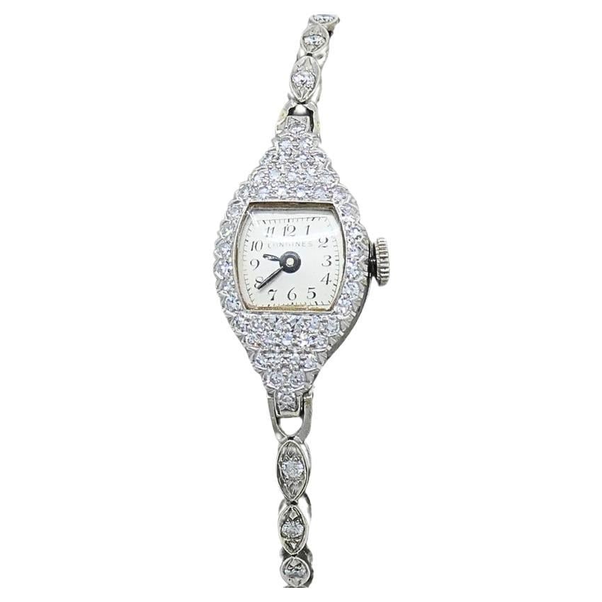 Longines Art Deco ladies platinum diamond wristwatch: Longines Art Deco ladies platinum diamond wristwatch Art Deco Longines ladies watch from the 1920s, made of platinum and set with diamonds. The watch features a teardrop-shaped case with diamond accen