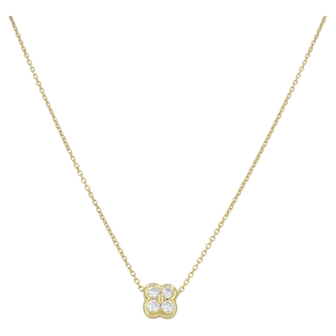 Tiffany & Co. Flower Pendant Necklace in 18k Yellow Gold with Diamonds: Tiffany & Co. Flower Pendant Necklace in 18k Yellow Gold with Diamonds Tiffany & Co. pendant necklace crafted in 18k yellow gold with a diamond flower motif. The design features a four-petal floral pe