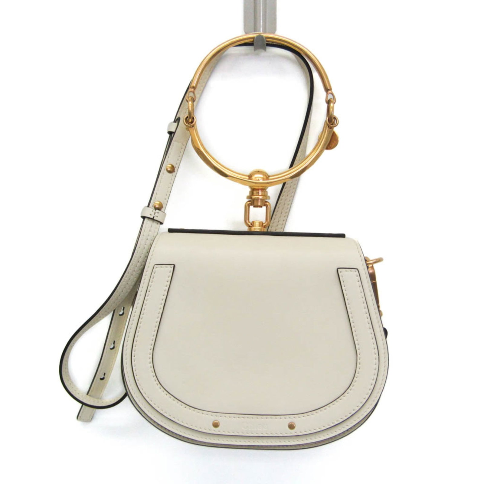 Chloe Nile beige leather crossbody bag 19cm x 15cm x 6cm: Chloe Nile beige leather crossbody bag 19cm x 15cm x 6cm This Chloe Nile Crossbody Bag is crafted from beige leather and features a compact, structured silhouette. Made in Italy, it is designed for wo