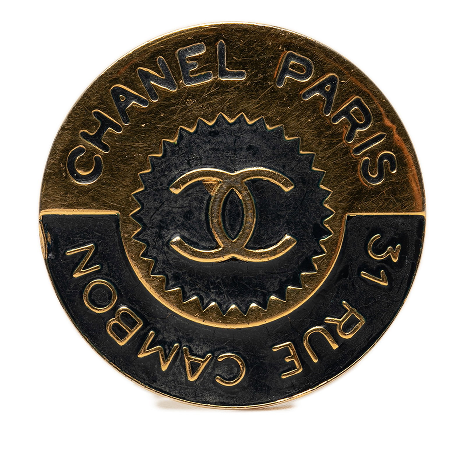 Chanel 31 Rue Cambon CC Enamel Gold Tone Brooch: Chanel 31 Rue Cambon CC Enamel Gold Tone Brooch Chanel CC brooch in gold-tone metal and enamel with a back pin closure. It is a costume accessory made in France and measures 4 cm by 4 cm. Condition is