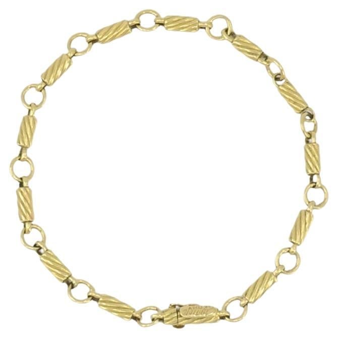 Cartier 18k Gold Link Bracelet Vintage 8 In: Cartier 18k Gold Link Bracelet Vintage 8 In Vintage Cartier bracelet crafted in 18k gold with a refined link pattern of alternating elongated and rounded links. This signed vintage piece dates to 1970