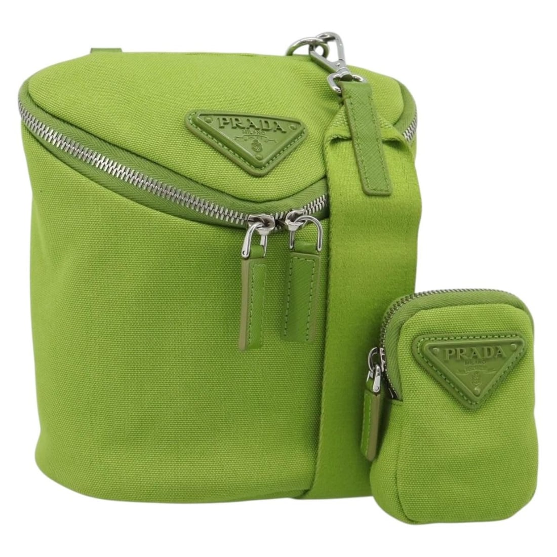 PRADA Canvas Shoulder Bag Green and Silver Made in Italy: PRADA Canvas Shoulder Bag Green and Silver Made in Italy This PRADA shoulder bag is crafted from canvas in green and silver, with a structured silhouette and shoulder strap. Made in Italy, it measures