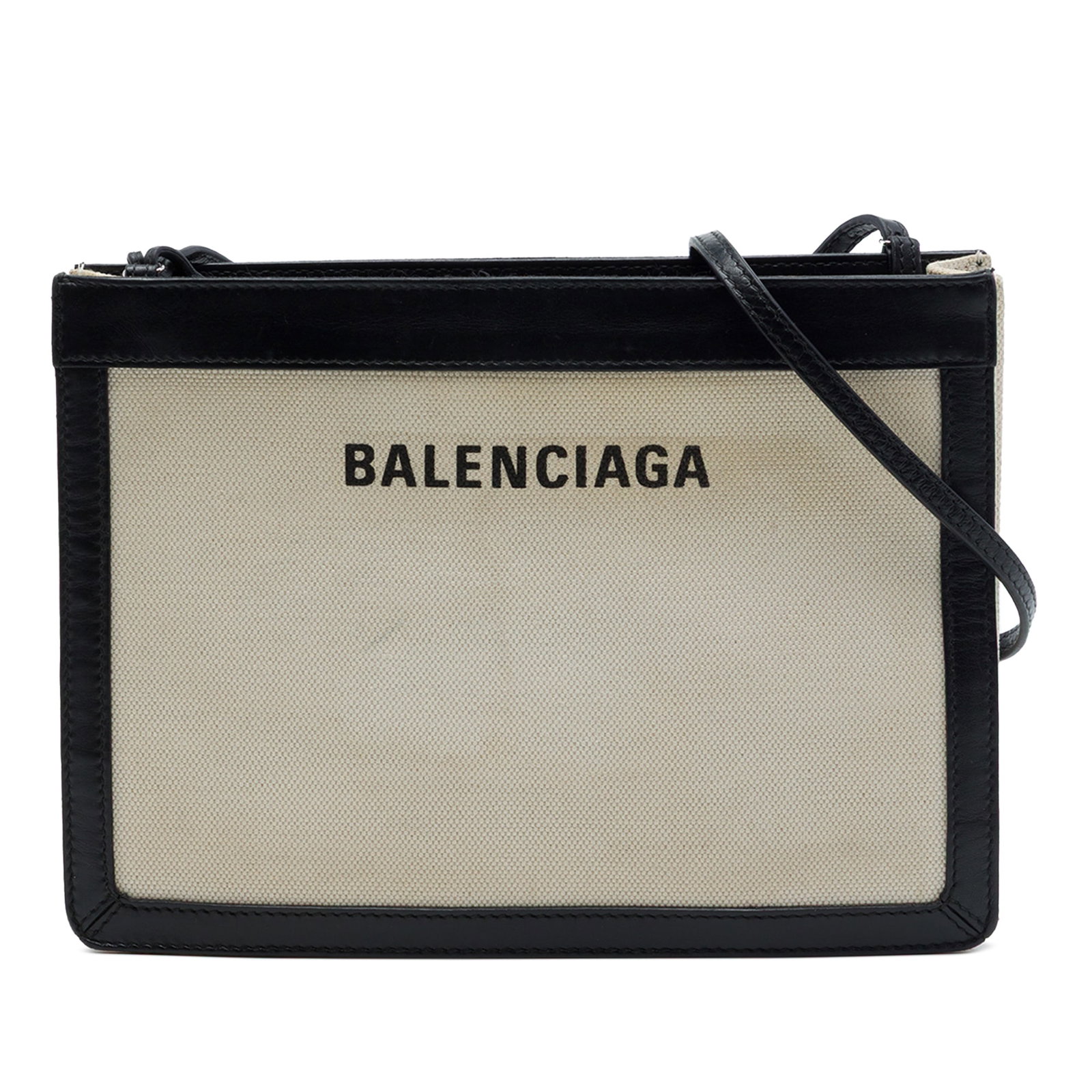 Balenciaga Navy Pochette Canvas Crossbody Bag with Leather Trim: Balenciaga Navy Pochette Canvas Crossbody Bag with Leather Trim Balenciaga Navy Pochette crossbody bag crafted with a canvas body and leather trim. It features an adjustable flat leather shoulder stra