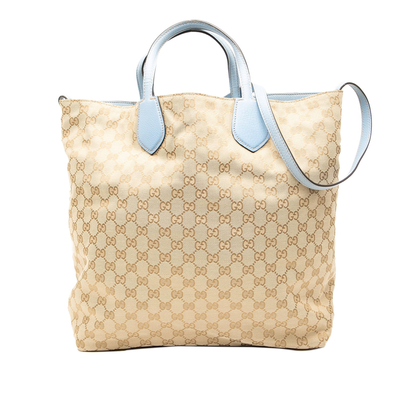 Gucci GG Canvas Reversible Tote with Leather Handles: Gucci GG Canvas Reversible Tote with Leather Handles The Gucci GG Canvas Reversible Tote is a stylish and functional accessory crafted from durable canvas. It features flat leather handles and an adju