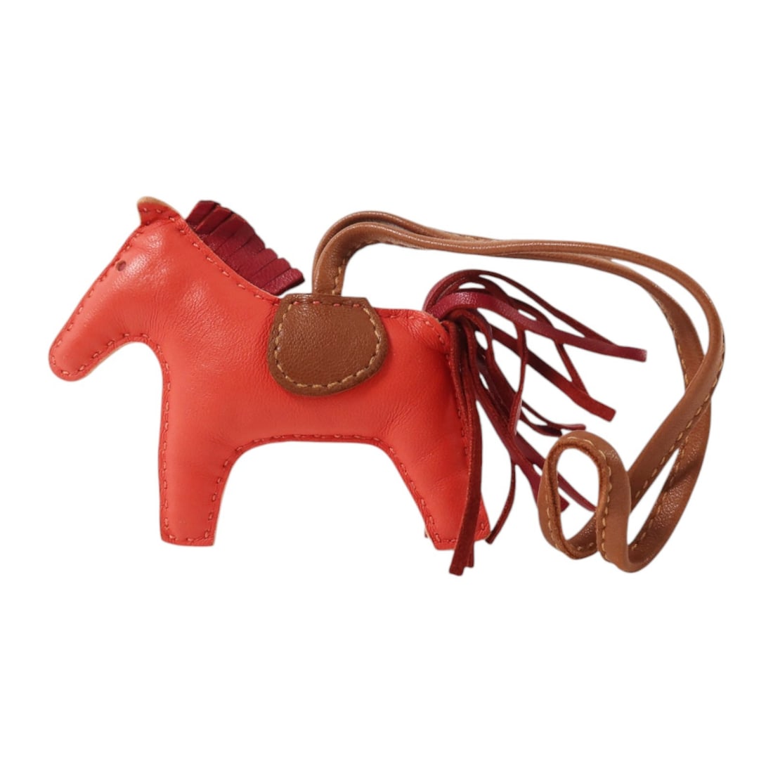 Hermes Rodeo PM Lambskin Bag Charm Jaipur Grenat Fauve: Hermes Rodeo PM Lambskin Bag Charm Jaipur Grenat Fauve Hermes Rodeo PM charm in Milo lambskin (sheep leather), presented in Jaipur/Grenat/Fauve color tones. It is a women's charm made in France and co
