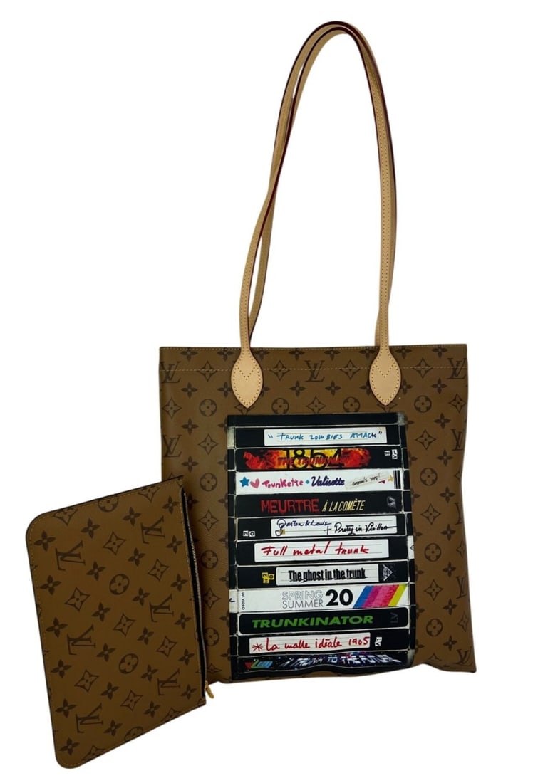 Carry It Reverse Monogram Video Tape Tote by Louis Vuitton Limited Edition: Carry It Reverse Monogram Video Tape Tote by Louis Vuitton Limited Edition This Louis Vuitton Carry It Limited Edition Tote Bag features the iconic reverse monogram canvas with a unique designer video