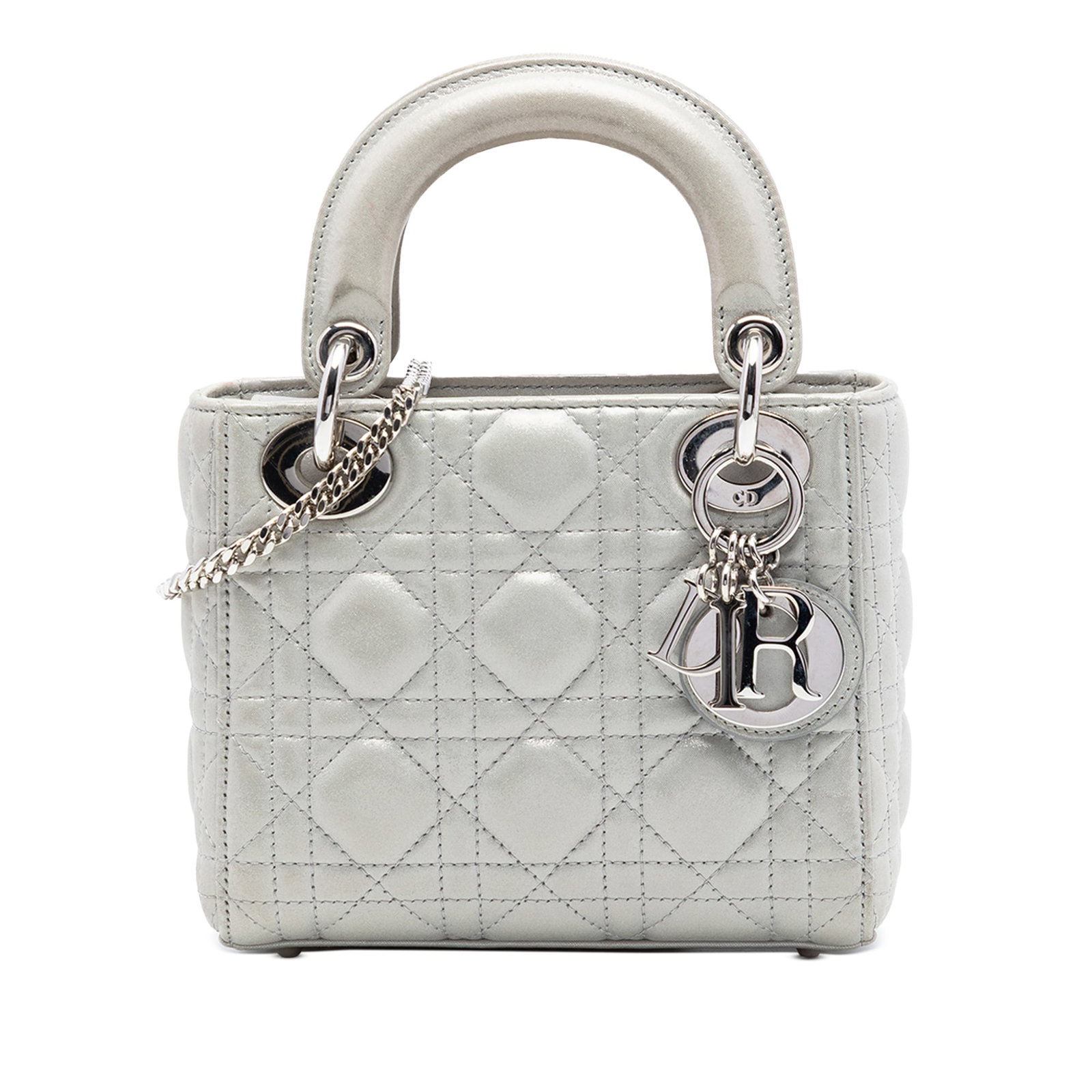 Dior Lady Dior Mini bag in iridescent lambskin silver: Dior Lady Dior Mini bag in iridescent lambskin silver Mini Lady Dior bag in silver iridescent lambskin leather with Cannage quilting. It features flat leather top handles, a detachable chain link stra
