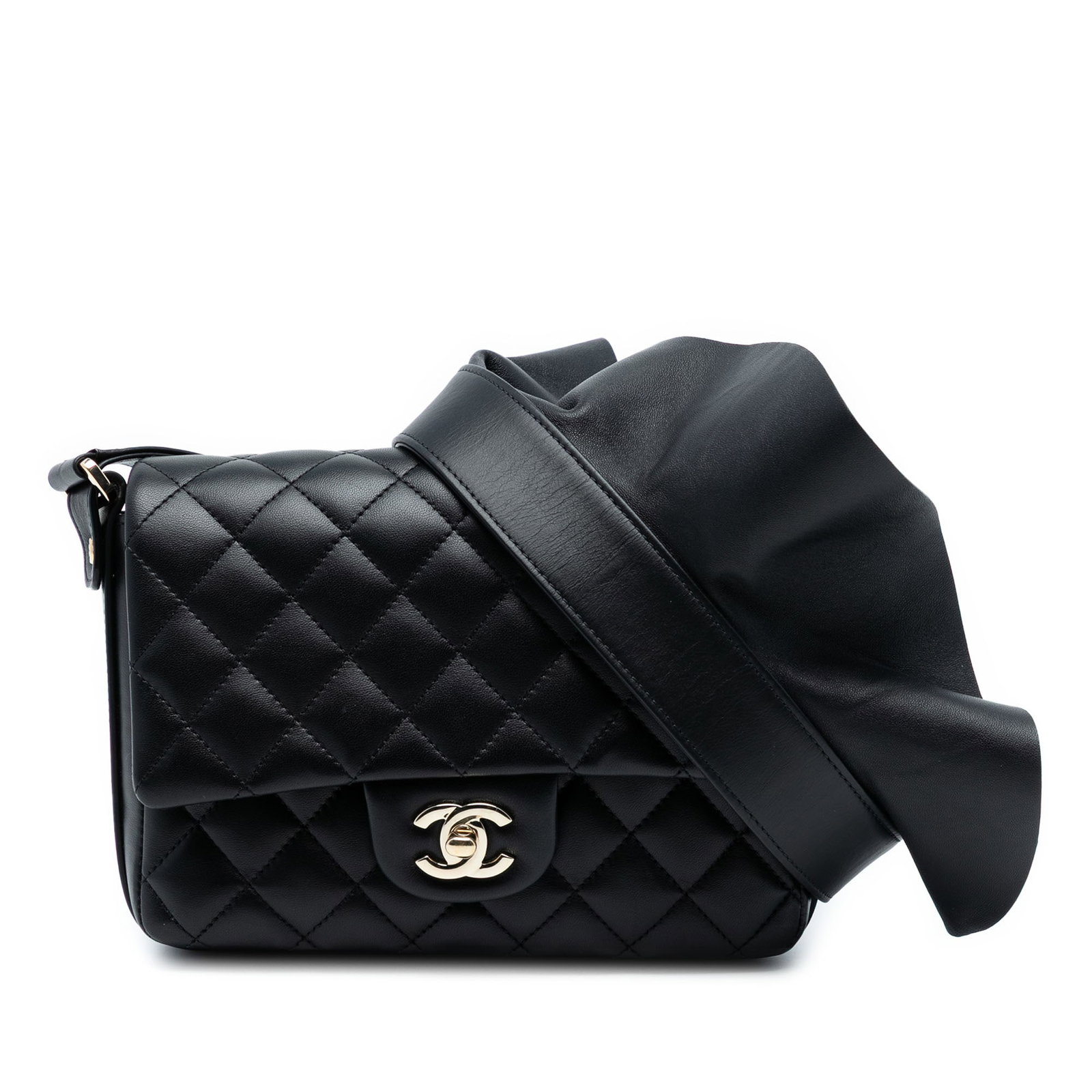 Chanel Bolero Quilted Calfskin Black Crossbody Bag with Flap and CC Turn Lock: Chanel Bolero Quilted Calfskin Black Crossbody Bag with Flap and CC Turn Lock This Chanel crossbody bag showcases a quilted calfskin leather body in black with a flat leather shoulder strap featuring 