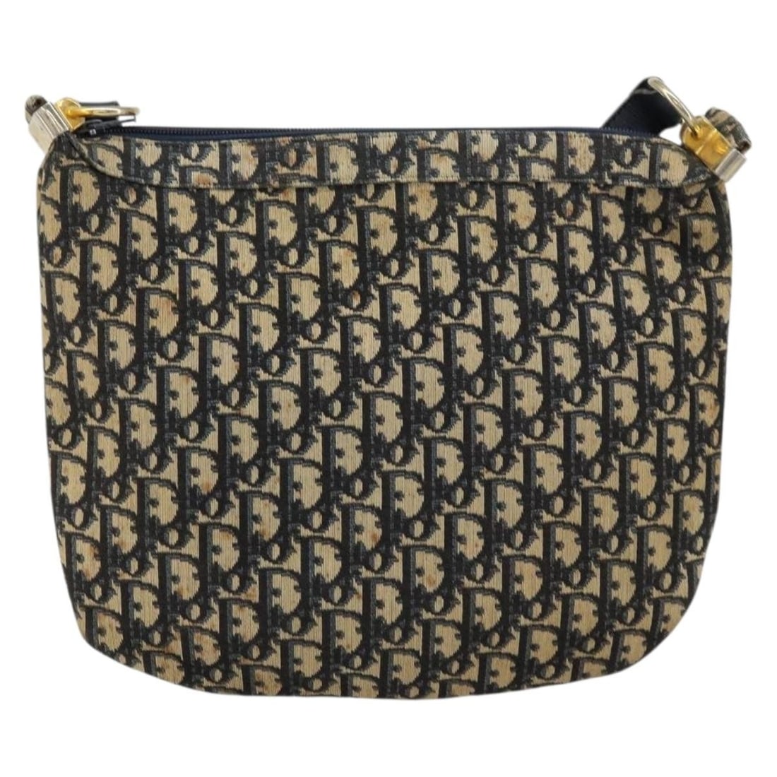 Christian Dior Vintage Trotter Navy Canvas Shoulder Bag: Christian Dior Vintage Trotter Navy Canvas Shoulder Bag This Christian Dior Vintage Trotter Shoulder Bag is crafted from navy canvas and designed for women. The bag features a spacious interior and ex