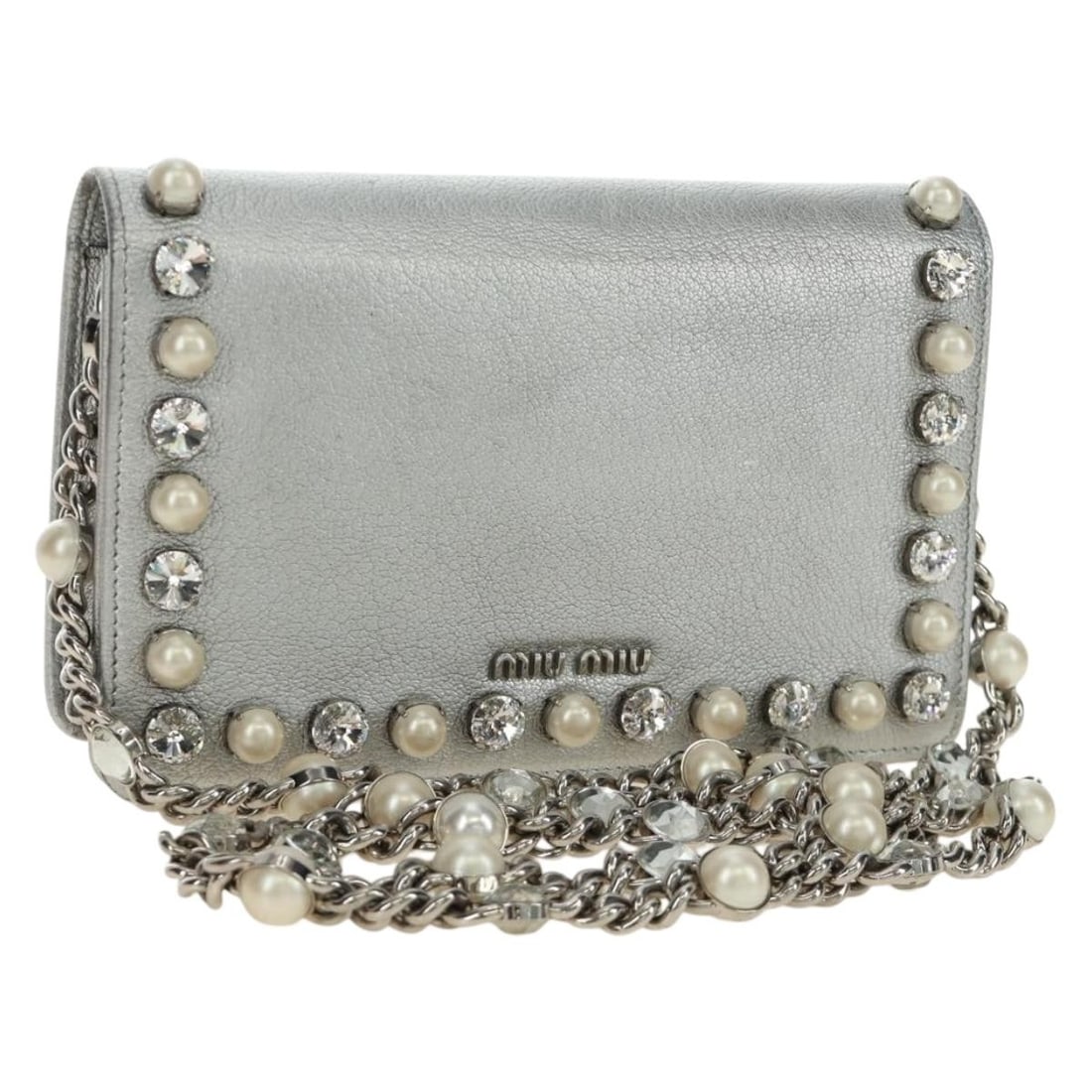 Leather Shoulder Bag by Miu Miu in Silver Made in Italy: Leather Shoulder Bag by Miu Miu in Silver Made in Italy Miu Miu shoulder bag in silver leather with a compact silhouette and shoulder strap. Includes a dust bag. Made in Italy. Condition is B with rea