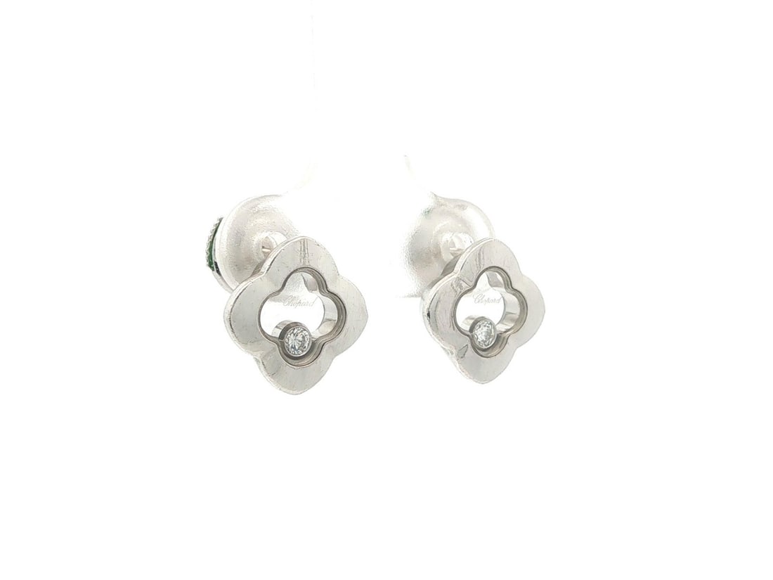 Chopard Happy Diamond Quatrefoil Stud Earrings in White Gold: Chopard Happy Diamond Quatrefoil Stud Earrings in White Gold Pre-owned Chopard Happy Diamond quatrefoil stud earrings crafted in solid 17-18k white gold. Each earring features a floating natural round