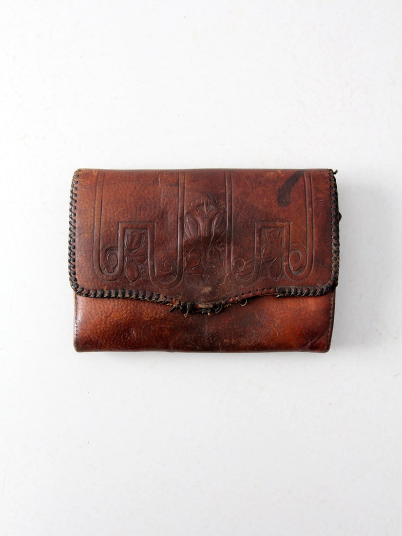 Early 20th Century Art Nouveau Tooled Leather Clutch: Early 20th Century Art Nouveau Tooled Leather Clutch This exquisite antique leather clutch from the early 20th century showcases intricate Art Nouveau tooling, adding a touch of vintage elegance to an