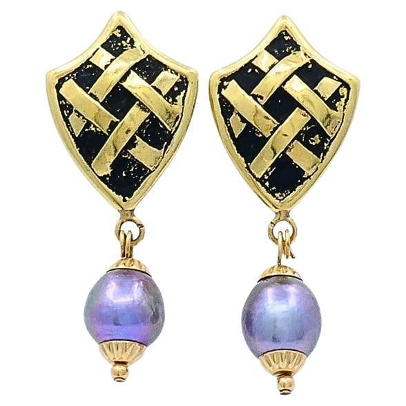 18K Gold Tahitian Pearl Dangle Earrings with Black Enamel: 18K Gold Tahitian Pearl Dangle Earrings with Black Enamel Elegant 18K gold drop earrings featuring Tahitian pearls, with shield-shaped gold tops accented by a black enamel background and woven gold pa