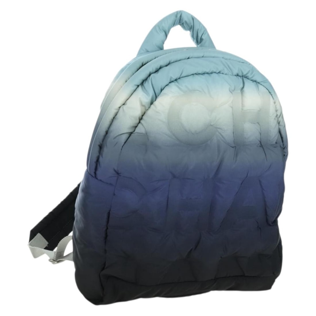 CHANEL Nylon Blue Silver Doudone Women Backpack: CHANEL Nylon Blue Silver Doudone Women Backpack This CHANEL Doudone backpack features a blue and silver nylon exterior with silver-tone hardware and the iconic CC logo. Designed for women, the backpac