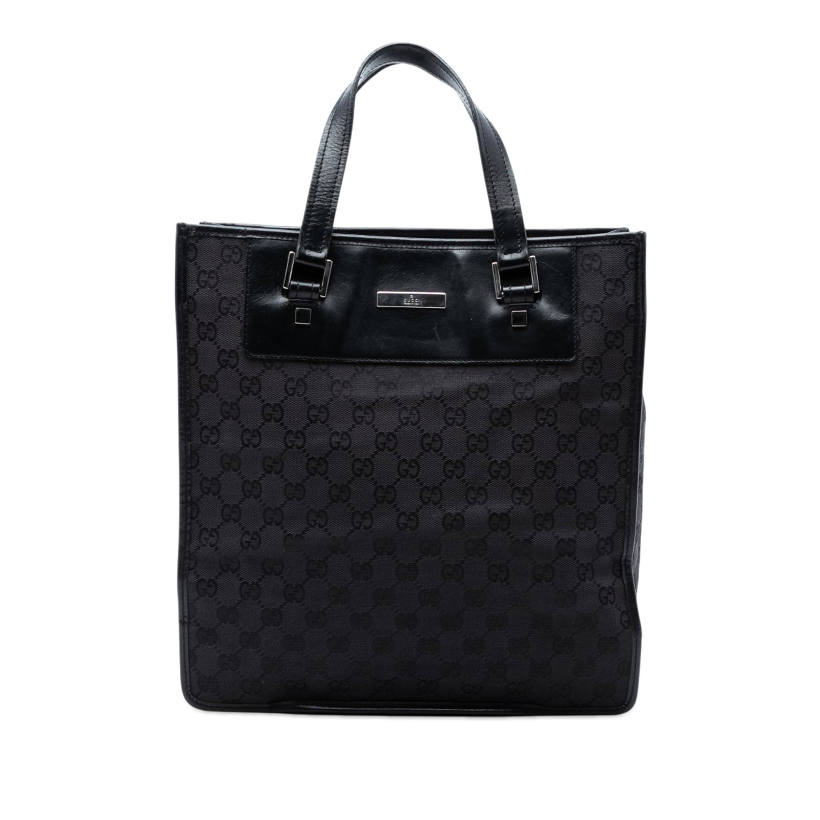 Gucci black GG canvas tote bag with leather trim: Gucci black GG canvas tote bag with leather trim This Gucci GG Canvas Tote features a canvas body with leather trim, flat leather handles, an open top with a magnetic button closure, and an interior s
