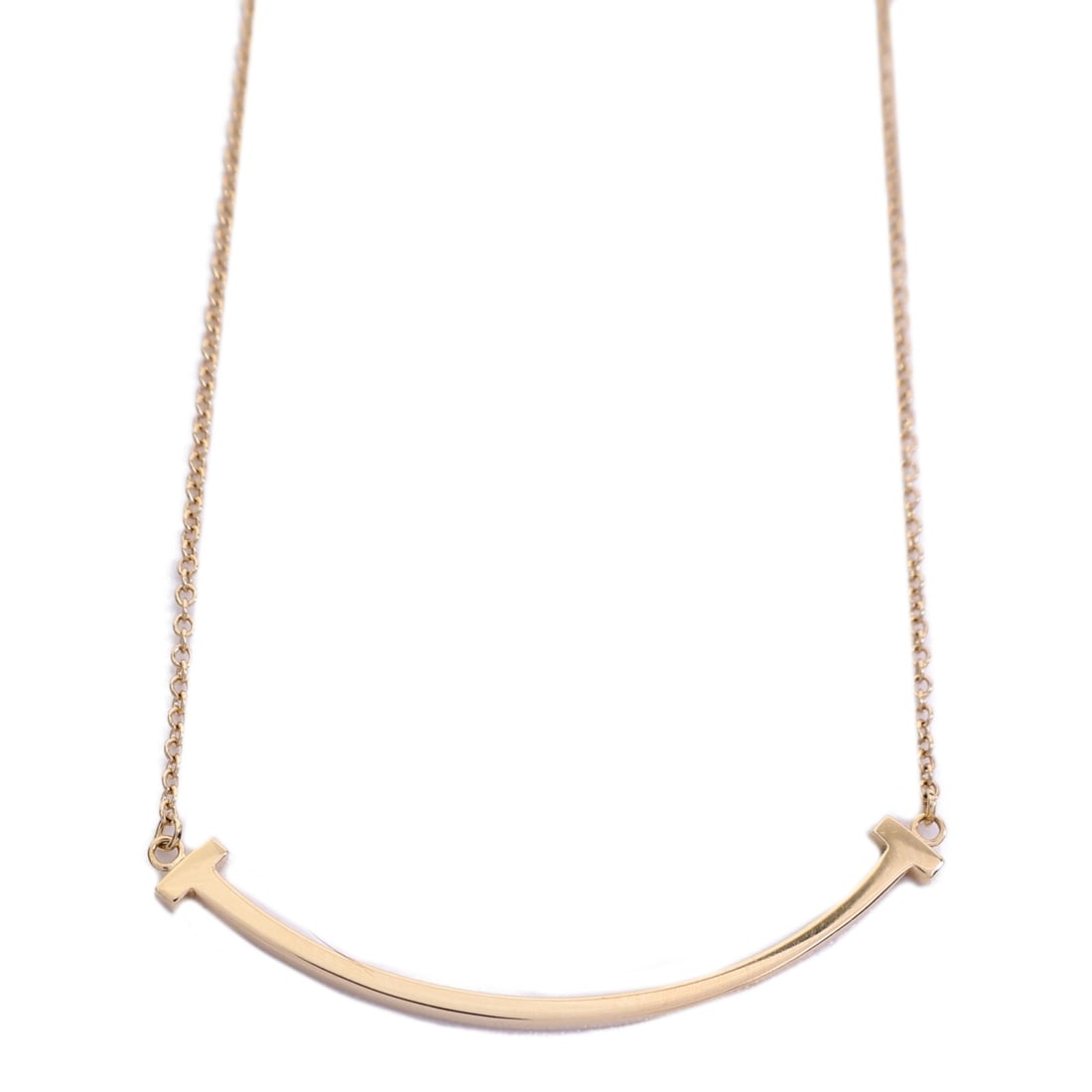 Tiffany Co T Smile 18K Rose Gold Necklace for Women: Tiffany Co T Smile 18K Rose Gold Necklace for Women Tiffany & Co. T Smile necklace crafted in 18K pink gold with a slim curved motif design. This women's necklace has no main stone and includes a stor