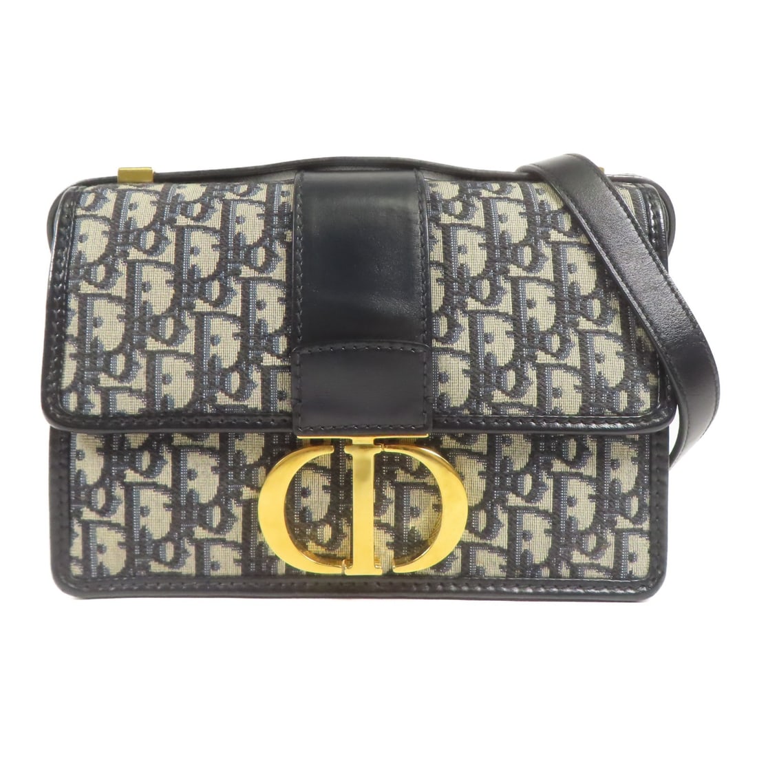 Dior Montaigne 30 Canvas Shoulder Bag Navy Beige CD GHW: Dior Montaigne 30 Canvas Shoulder Bag Navy Beige CD GHW Christian Dior Montaigne 30 shoulder bag in navy and beige canvas. This women's shoulder bag features a flap design with exterior and interior p