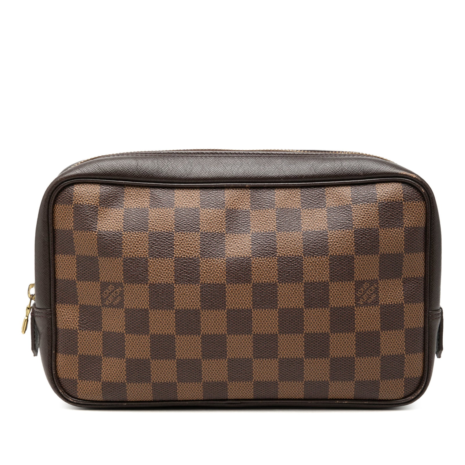Louis Vuitton Trousse Toilette 25 Damier Ebene Cosmetic Pouch: Louis Vuitton Trousse Toilette 25 Damier Ebene Cosmetic Pouch Louis Vuitton Trousse Toilette 25 in Damier Ebene canvas with leather trim and a zip-around closure. The interior includes slip pockets. C