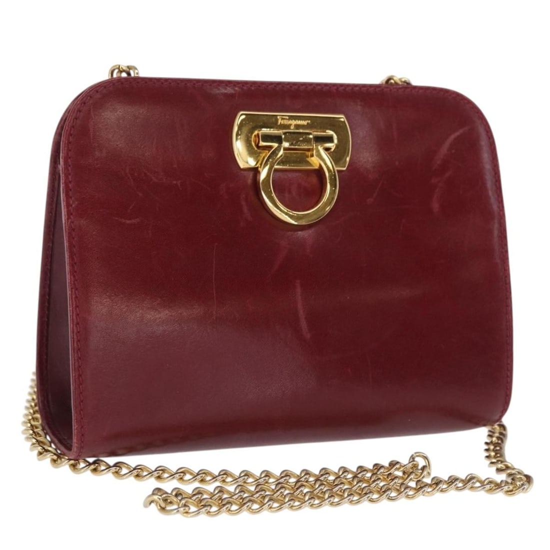 Red Leather Gancini Chain Shoulder Bag by Salvatore Ferragamo Italy: Red Leather Gancini Chain Shoulder Bag by Salvatore Ferragamo Italy This Salvatore Ferragamo Gancini chain shoulder bag features a red leather exterior with gold-tone accents. It is designed with a co