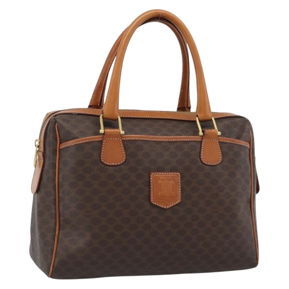 CELINE Boston Bag Macadam Canvas PVC Leather Brown Gold: CELINE Boston Bag Macadam Canvas PVC Leather Brown Gold This CELINE Boston bag is crafted from PVC leather with Macadam canvas in a brown and gold colorway. It was made in Italy and features a handle 