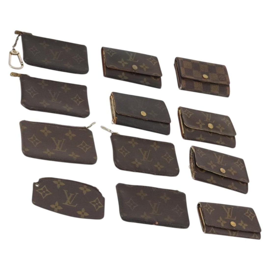 Set of 12 Louis Vuitton Monogram Canvas Coin Purses: Set of 12 Louis Vuitton Monogram Canvas Coin Purses Set of 12 Louis Vuitton monogram coin purses in monogram canvas. This bundle includes only the items shown in the photo; item box and dust bag are n