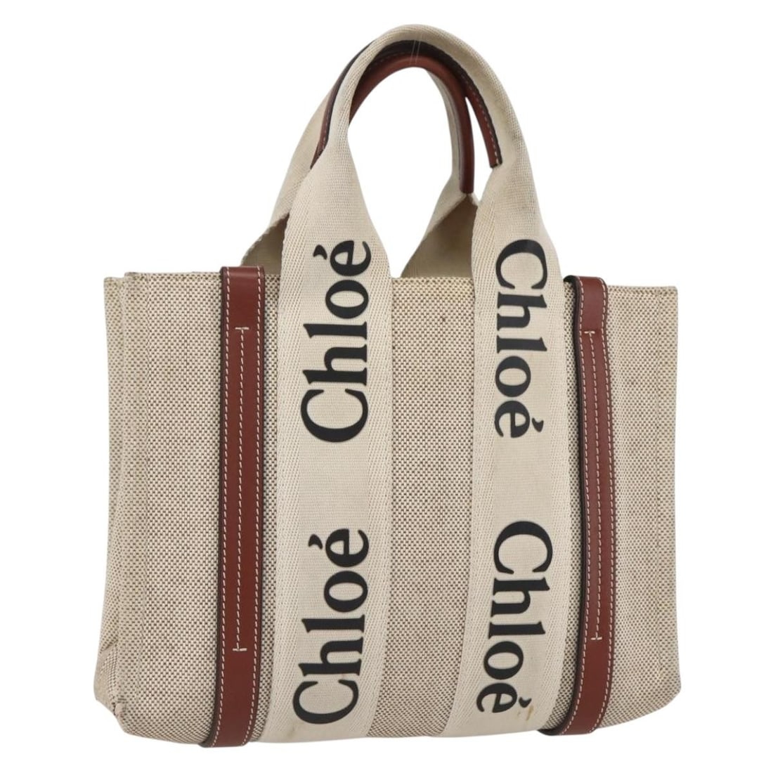 Chloe Woody Tote Canvas and Leather Bag in Beige and Brown: Chloe Woody Tote Canvas and Leather Bag in Beige and Brown This Chloe Woody La Tote Bag features a beige and brown canvas exterior with leather accents. Made in Italy, this tote bag is designed with p