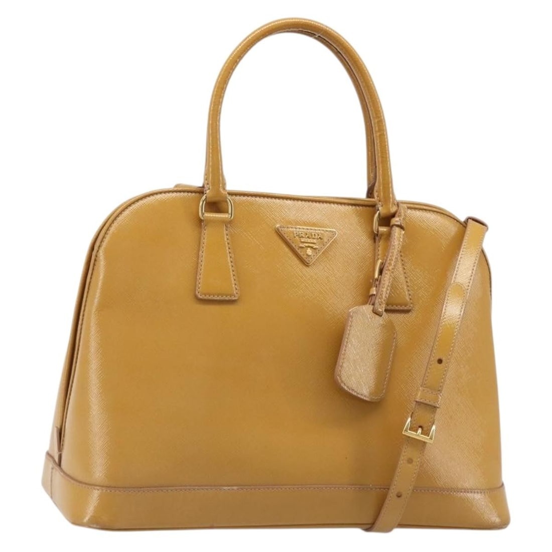 PRADA Beige Leather 2way Handbag with Shoulder Strap and Name Tag: PRADA Beige Leather 2way Handbag with Shoulder Strap and Name Tag Prada 2-way handbag in beige leather with gold-tone accents. Made in Italy, this women's bag includes a shoulder strap and name tag. C