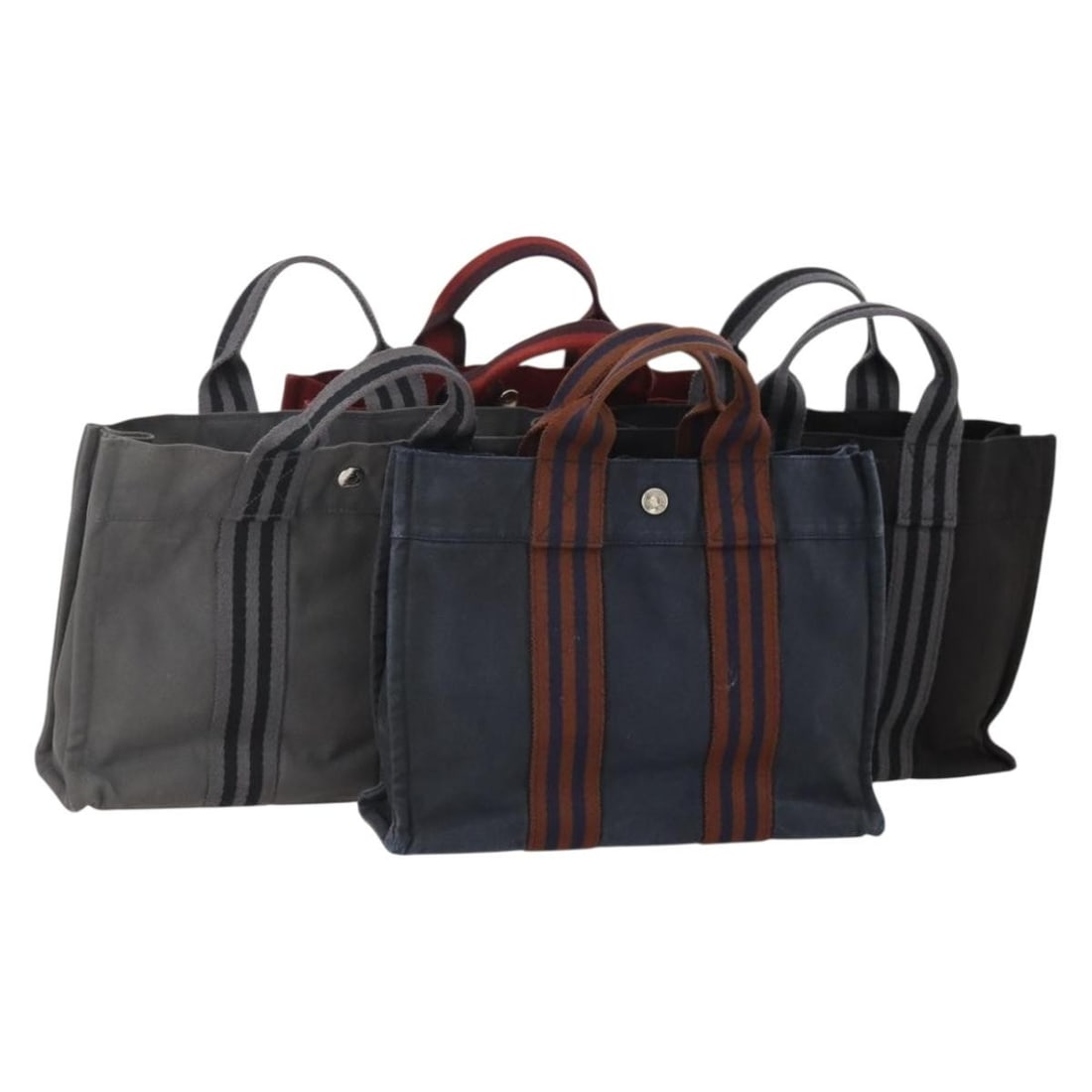 Set of 4 Hermes Fourre Tout PM Canvas Handbags Gray Red Navy: Set of 4 Hermes Fourre Tout PM Canvas Handbags Gray Red Navy Hermes Fourre Tout PM hand bag in canvas with gray, red, and navy exterior colors. Made in France, this item is listed as a special set sal