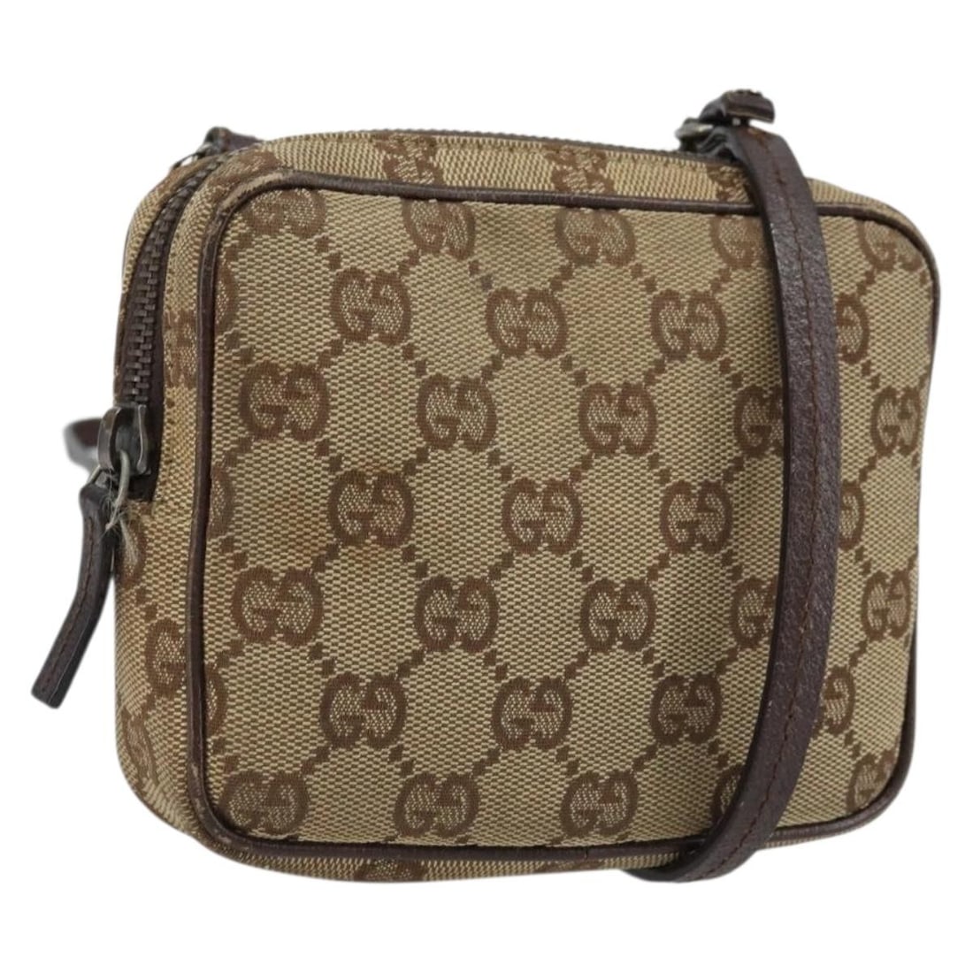 Beige Silver GG Canvas Shoulder Bag by Gucci Model 120975: Beige Silver GG Canvas Shoulder Bag by Gucci Model 120975 This authentic Gucci GG Canvas shoulder bag features a beige and silver exterior, crafted from the brand's signature GG canvas material. Desig