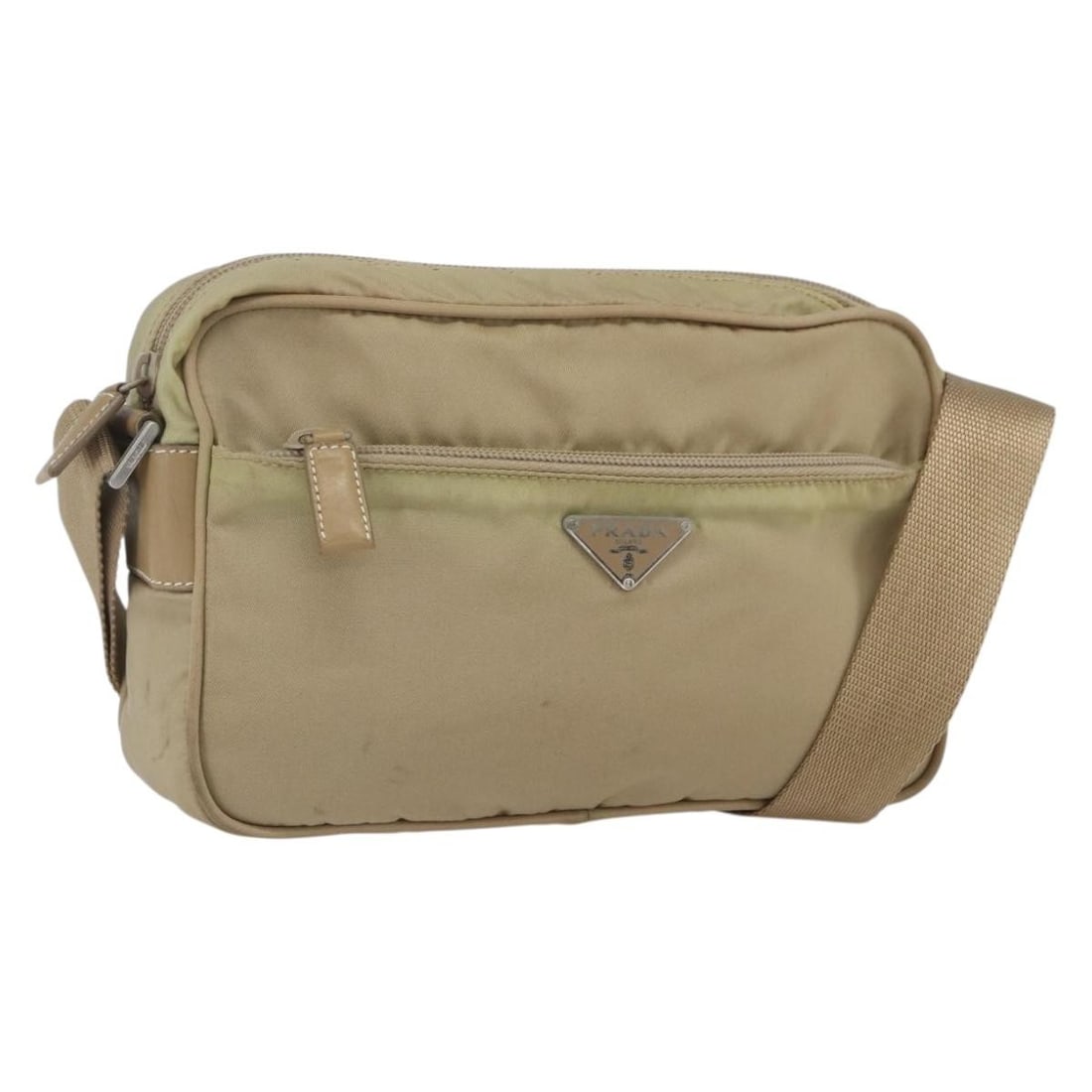 PRADA Nylon Shoulder Bag in Beige with Silver Tone Hardware: PRADA Nylon Shoulder Bag in Beige with Silver Tone Hardware Authentic Prada shoulder bag in beige and silver nylon, made in Italy. This women's bag has an adjustable shoulder strap and is offered with