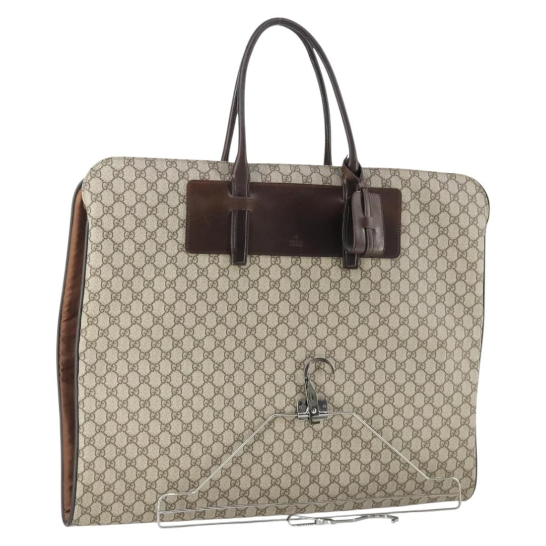 Beige GG Supreme Garment Cover by Gucci PVC Leather: Beige GG Supreme Garment Cover by Gucci PVC Leather This is a GUCCI GG Supreme garment cover crafted from beige PVC leather and GG canvas. Made in Italy, this garment cover features dual top handles f