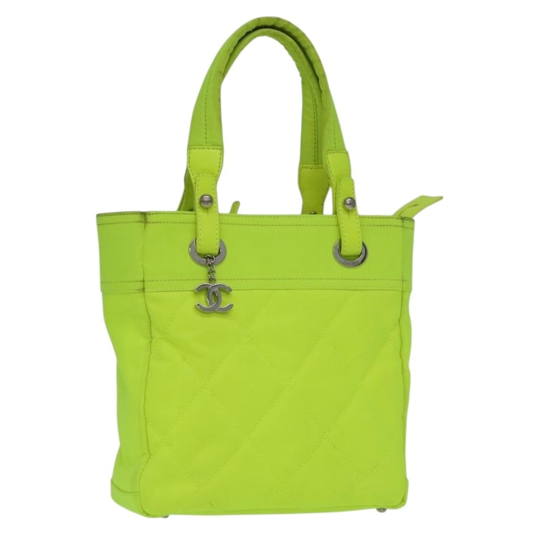 Chanel Paris Biarritz PM Canvas Tote Bag Green Neon Green: Chanel Paris Biarritz PM Canvas Tote Bag Green Neon Green Chanel Paris Biarritz PM tote bag in green and neon green canvas with charm. Made in Italy, this women's tote features a structured everyday s
