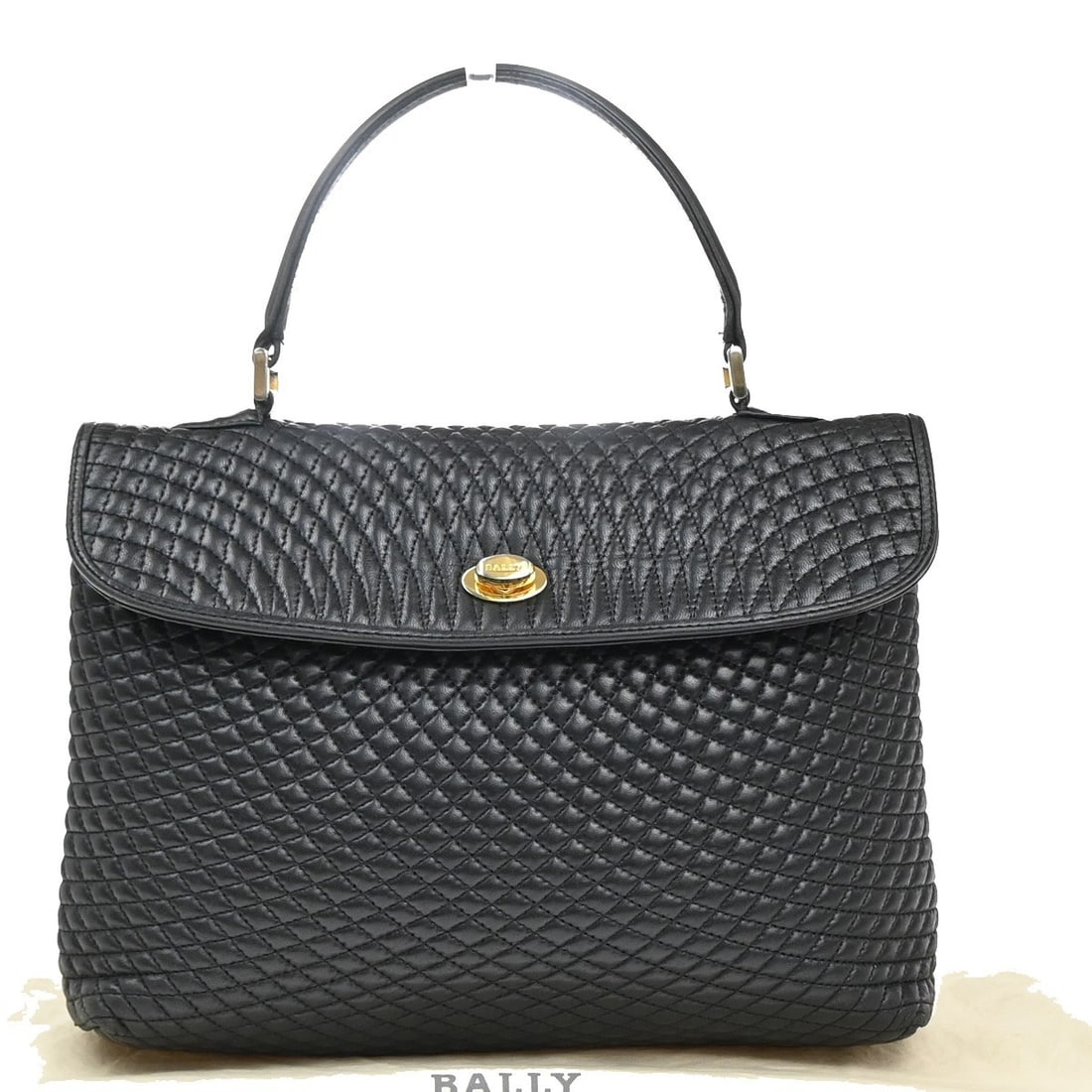 Bally Vintage Black Leather Quilted Handbag Italy: Bally Vintage Black Leather Quilted Handbag Italy This Bally vintage handbag features quilted black leather and is designed for women. The bag was crafted in Italy and shows signs of use, including sc