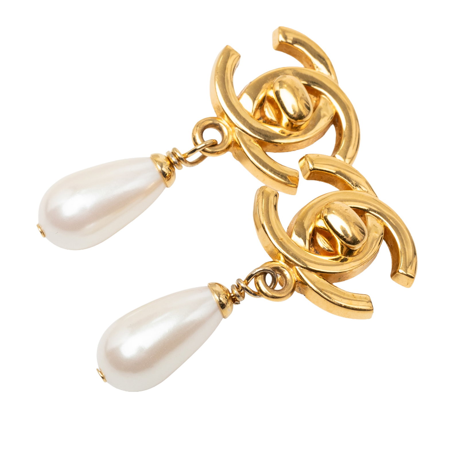 Chanel CC Turn Lock Faux Pearl Gold Plated Clip Earrings: Chanel CC Turn Lock Faux Pearl Gold Plated Clip Earrings Chanel clip-on earrings featuring the CC turn lock motif with faux pearl drops. Crafted in gold plated metal, this costume jewelry pair is made