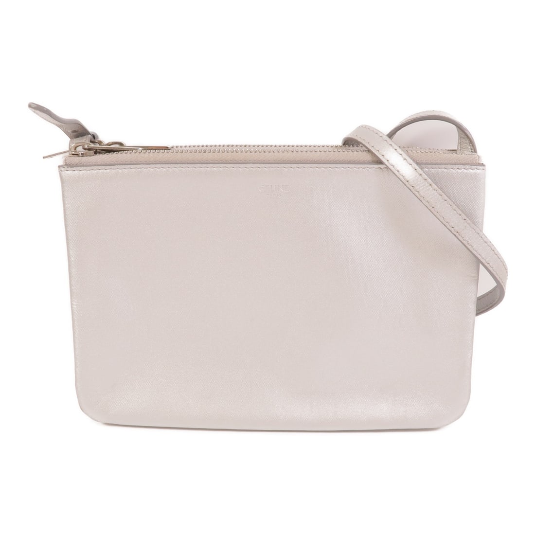 CELINE Trio silver coated canvas shoulder bag: CELINE Trio silver coated canvas shoulder bag Celine Trio shoulder bag in silver PVC coated canvas. This women's shoulder bag features a slim profile with a fastener closure and shows reasonable wear 