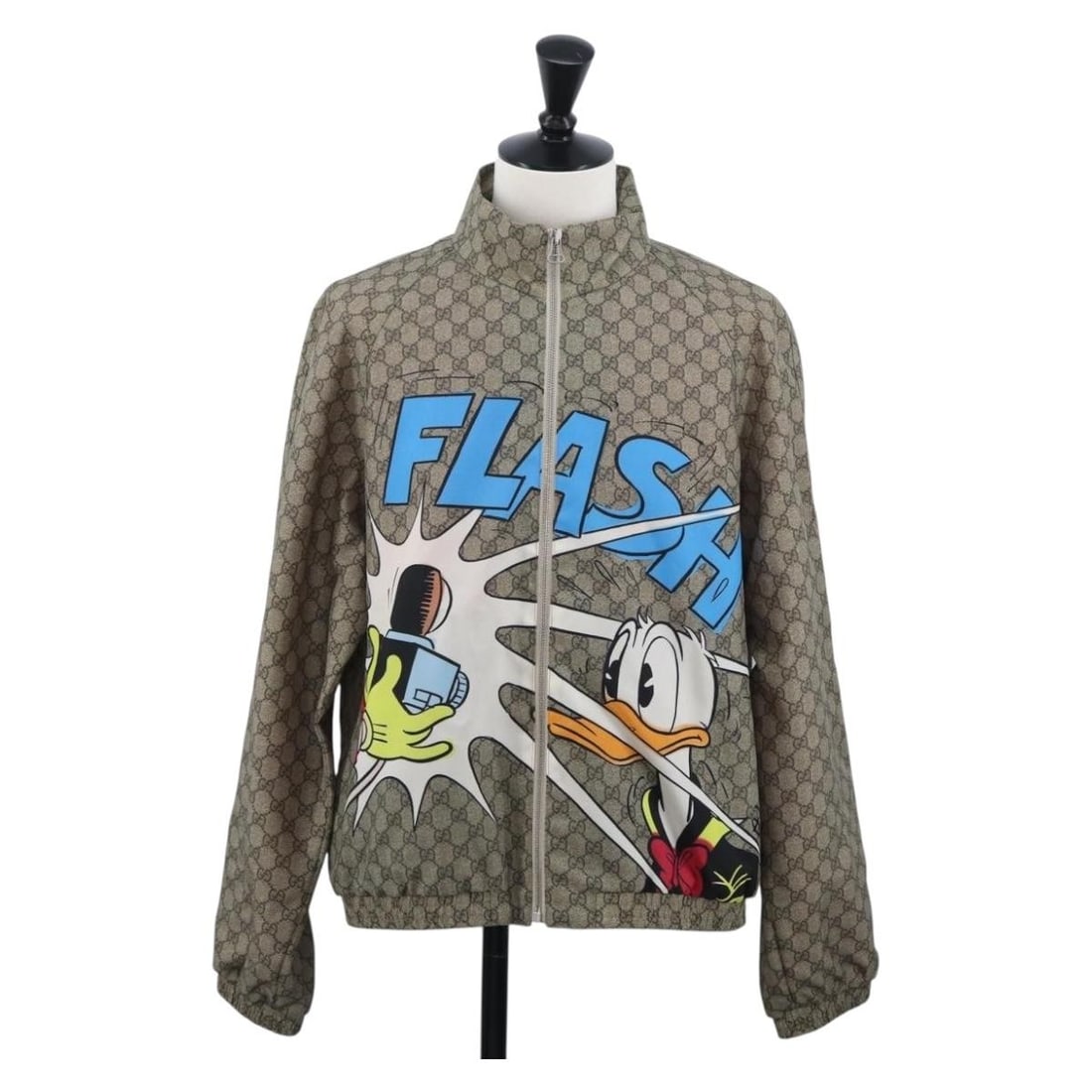 Gucci Donald Duck GG Canvas Blouson Jacket Beige Women: Gucci Donald Duck GG Canvas Blouson Jacket Beige Women A Gucci women's jacket in beige GG Canvas, made in Italy. This blouson-style piece is listed in excellent condition, with slight scratches to the