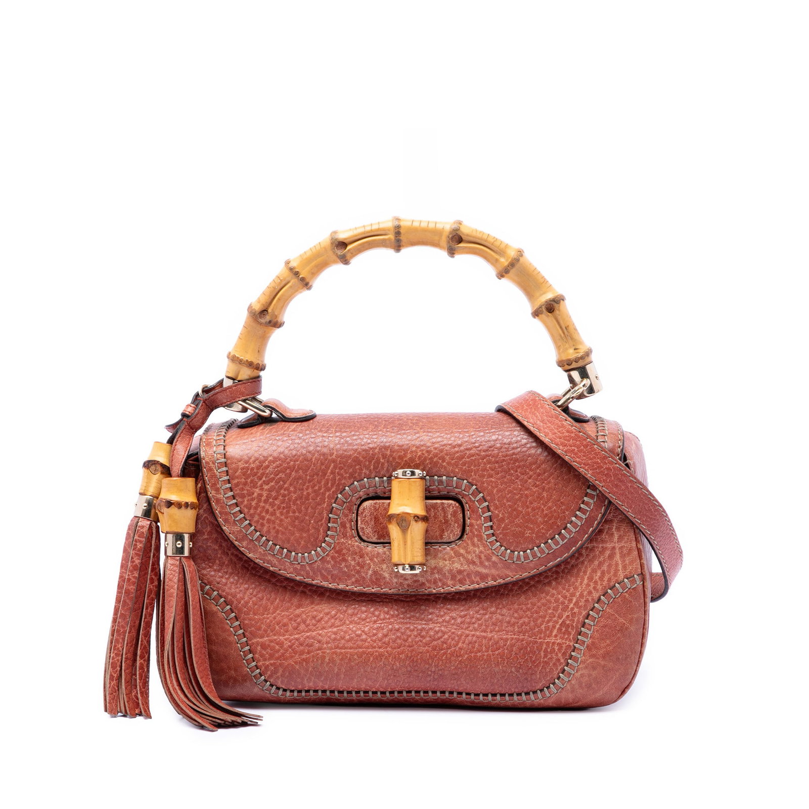 Gucci New Bamboo Medium Red Leather Satchel Bag: Gucci New Bamboo Medium Red Leather Satchel Bag Gucci New Bamboo medium satchel crafted in red leather with tassel detail and the collection's signature bamboo top handle. The bag features a detachabl