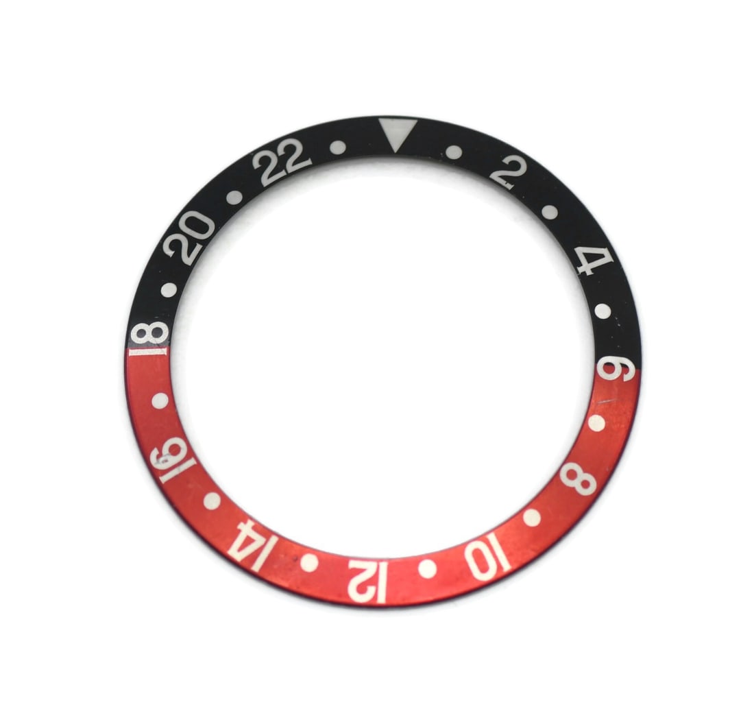 Rolex 16710 Coke bezel insert for GMT Master: Rolex 16710 Coke bezel insert for GMT Master Pre-owned Rolex GMT-Master Coke insert 16710. This is an authentic insert made in Switzerland and listed as compatible with the Rolex GMT-Master. Specifica