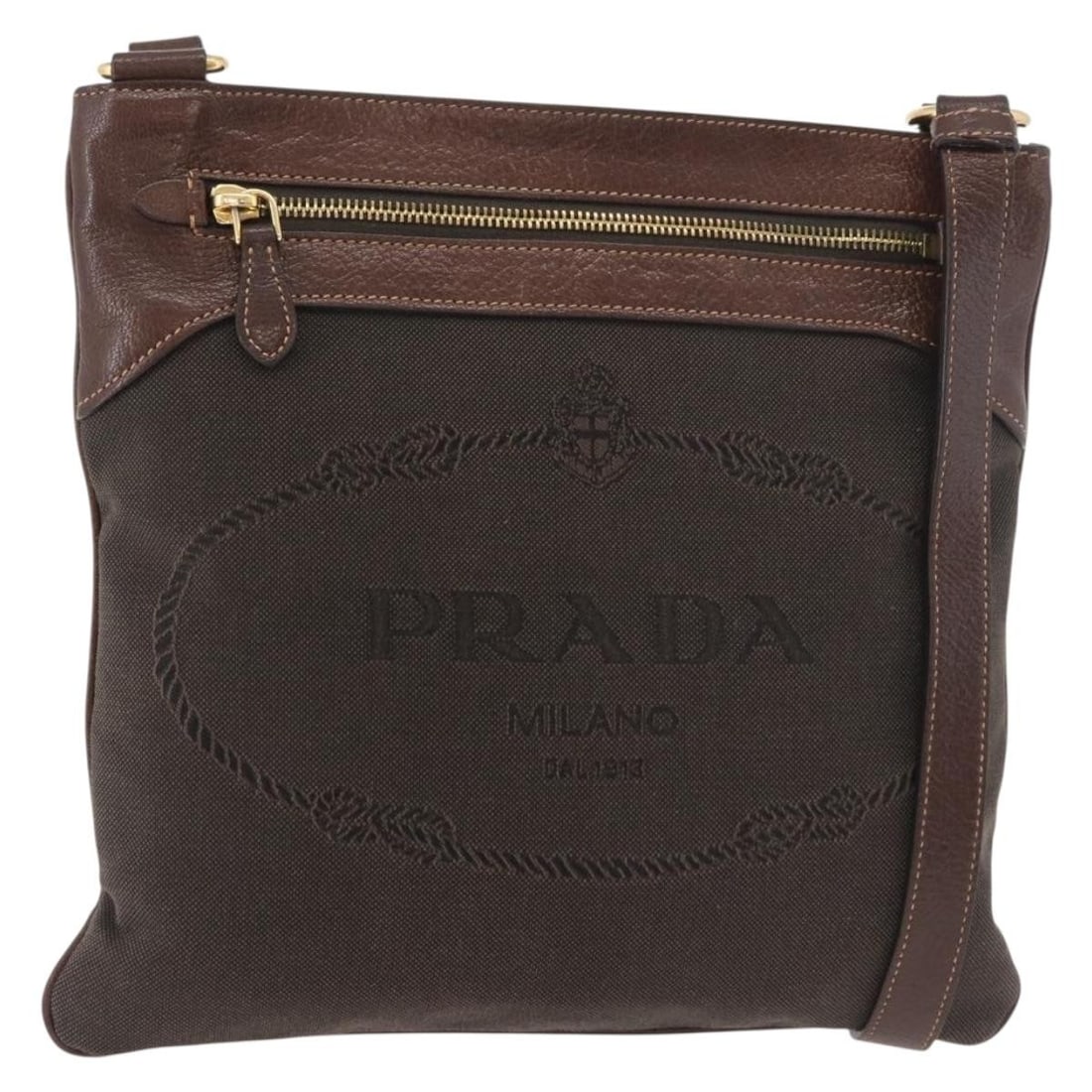 PRADA Brown Gold Canvas Shoulder Bag with Guarantee Card: PRADA Brown Gold Canvas Shoulder Bag with Guarantee Card Prada shoulder bag in brown and gold canvas with a slim profile and adjustable shoulder strap. Includes the guarantee card. Made in Turkey. Con